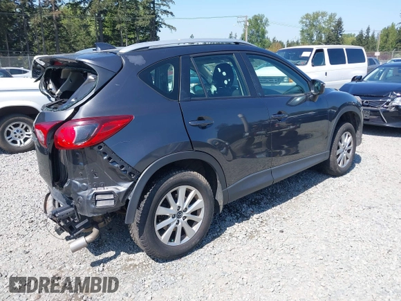 2015 Mazda CX-5 Sport z VIN JM3KE4BY5F0540612, wystawiony jako IAAI lot #42109082 z przebiegiem 83 874 mil mil oraz . Historia ofert i sprzedaży dostępna na DreamBid. Obrazek 4.