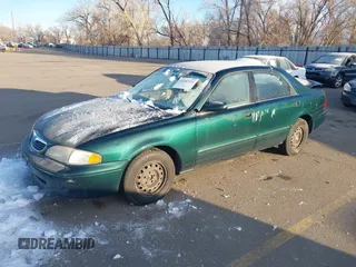 1998 Mazda 626 DX with VIN 1YVGF22C9W5721679, listed as a IAAI auction lot 41287224 with 134,384 mi miles. Bid and sale history available at carsss.com. Image 2.