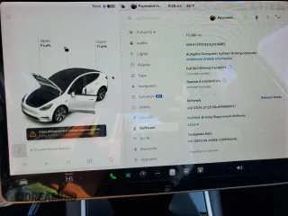 2020 Tesla Model Y Long Range with VIN 5YJYGDEE4LF015455, listed as a Copart auction lot 84223984 with 77,398 mi miles and Salvage Title. Bid and sale history available at DreamBid. Image 9.