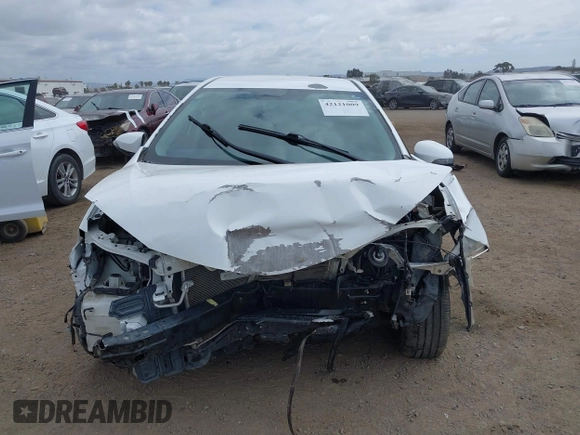 2014 Toyota Corolla L with VIN 5YFBURHE2EP085339, listed as a IAAI auction lot 42121009 with 122,339 mi miles and . Bid and sale history available at DreamBid. Image 6.