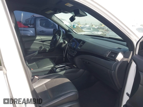 2023 Honda Passport Elite with VIN 5FNYF8H07PB010220, listed as a IAAI auction lot 41675730 with 25,128 mi miles and . Bid and sale history available at DreamBid. Image 5.