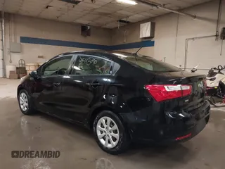 2014 Kia Rio LX with VIN KNADM4A31E6404206, listed as a IAAI auction lot 41543090 with 70,563 mi miles and . Bid and sale history available at DreamBid. Image 3.