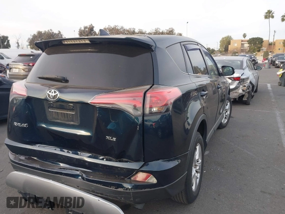 2018 Toyota RAV4 XLE with VIN JTMWFREV2JJ151595, listed as a IAAI auction lot 41380691 with 79,515 mi miles and . Bid and sale history available at carsss.com. Image 4.