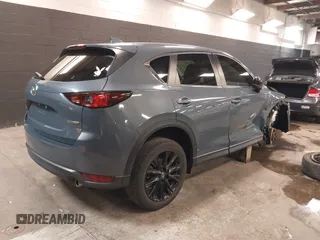 2021 Mazda CX-5 Touring with VIN JM3KFBCM5M0394707, listed as a IAAI auction lot 41887973 with 44,670 mi miles. Bid and sale history available at carsss.com. Image 4.