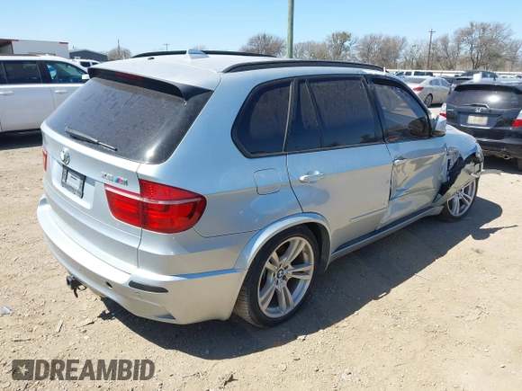 2011 BMW X5 M with VIN 5YMGY0C53BLK26167, listed as a IAAI auction lot 41742529 with 118,777 mi miles. Bid and sale history available at carsss.com. Image 4.