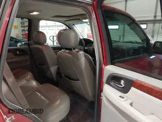 2005 GMC Envoy SLT with VIN 1GKDT13S352324863, listed as a IAAI auction lot 41707649 with 247,326 mi miles. Bid and sale history available at carsss.com. Image 8.