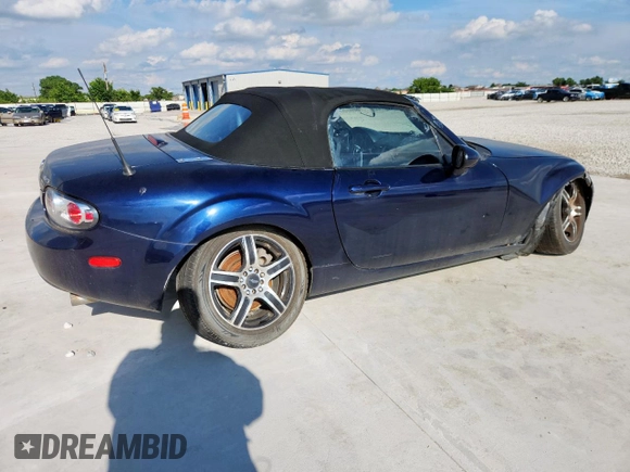 2007 Mazda MX-5 Miata Touring with VIN JM1NC25F770138120, listed as a Copart auction lot 60777425 with 184,029 mi miles and Salvage title. Bid and sale history available at DreamBid. Image 3.