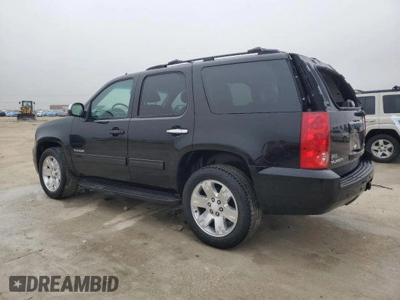2012 GMC Yukon SLT with VIN 1GKS1CE04CR158460, listed as a Copart auction lot 84459174 with 153,662 mi miles and Salvage Title. Bid and sale history available at carsss.com. Image 2.