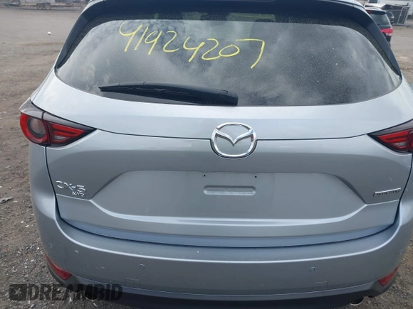 2021 Mazda CX-5 Grand Touring with VIN JM3KFBDM3M0354348, listed as a IAAI auction lot 41924207 with 45,786 mi miles. Bid and sale history available at carsss.com. Image 16.