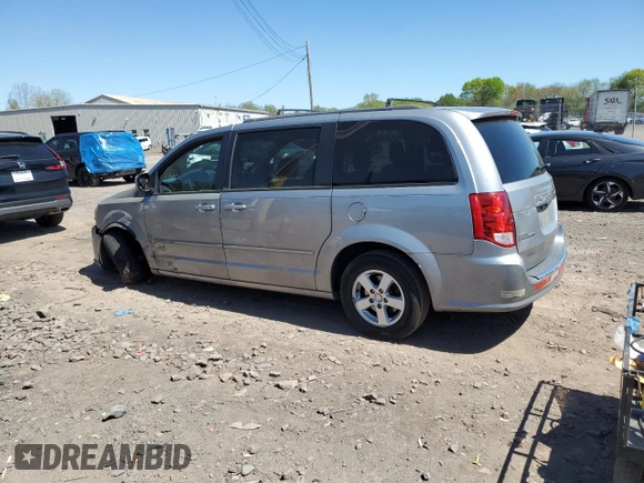 2013 Dodge Grand Caravan SXT with VIN 2C4RDGCG0DR582254, listed as a Copart auction lot 54735205 with 126,071 mi miles and Salvage Title. Bid and sale history available at DreamBid. Image 2.