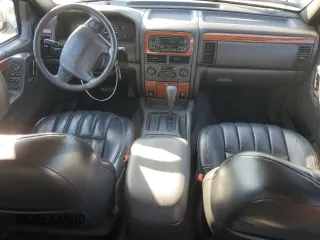 1999 Jeep Grand Cherokee Limited with VIN 1J4G268SXXC759016, listed as a Copart auction lot 80307534 with 215,870 mi miles and Salvage title. Bid and sale history available at DreamBid. Image 8.