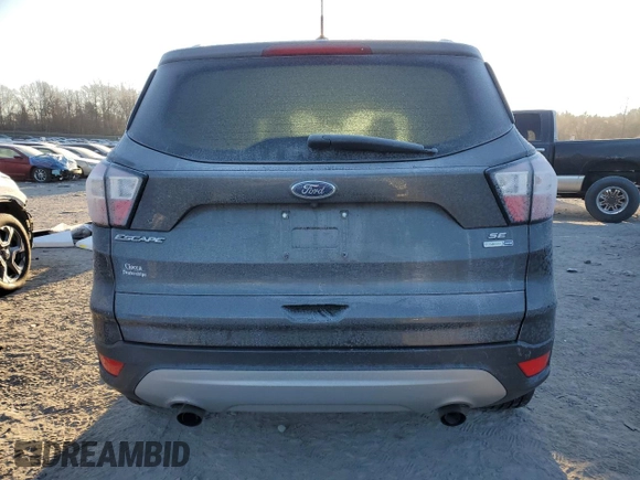 2018 Ford Escape SE z VIN 1FMCU9GD7JUA19262, wystawiony jako Copart lot #84627944 z przebiegiem 89 993 mil mil oraz Szkoda całkowita • Salvage title. Historia ofert i sprzedaży dostępna na DreamBid. Obrazek 6.