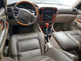2001 Lexus LX 470 z VIN JTJHT00W513509447, wystawiony jako Copart lot #43988595 z przebiegiem 251 861 mil mil oraz Tytuł czysty. Historia ofert i sprzedaży dostępna na DreamBid. Obrazek 8.