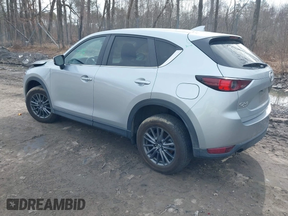 2021 Mazda CX-5 Touring with VIN JM3KFBCM9M1329806, listed as a IAAI auction lot 41825123 with 59,300 mi miles. Bid and sale history available at carsss.com. Image 3.