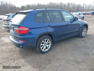 2011 BMW X5 35i with VIN 5UXZV4C56BL412415, listed as a IAAI auction lot 41611847 with 141,848 mi miles. Bid and sale history available at carsss.com. Image 4.