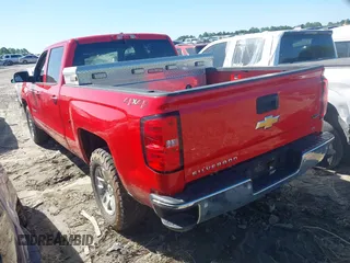 2018 Chevrolet Silverado 1500 LT with VIN 1GCUKREC0JF222376, listed as a IAAI auction lot 42121748 with 143,472 mi miles and . Bid and sale history available at DreamBid. Image 3.
