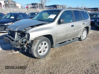 2003 GMC Envoy SLE with VIN 1GKDT13S732168534, listed as a IAAI auction lot 38049193 with 230,894 mi miles. Bid and sale history available at carsss.com. Image 2.