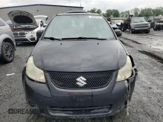 2011 Suzuki SX4 LE z VIN JS2YC5A28B6300625, wystawiony jako Copart lot #54044155 z przebiegiem 179 269 mil mil oraz Szkoda całkowita • Salvage title. Historia ofert i sprzedaży dostępna na DreamBid. Obrazek 5.