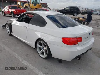 2013 BMW 3 Series 335i with VIN WBAKG7C53DJ438190, listed as a IAAI auction lot 41712275 with 126,357 mi miles. Bid and sale history available at carsss.com. Image 3.