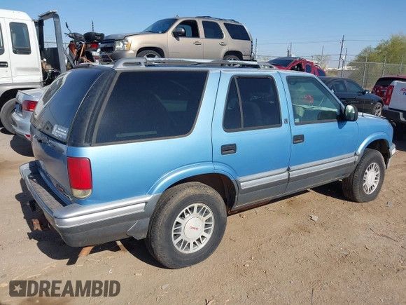 1997 GMC Jimmy SLS z VIN 1GKDT13W1V2514504, wystawiony jako IAAI lot #42211457 z przebiegiem 199 589 mil mil oraz . Historia ofert i sprzedaży dostępna na DreamBid. Obrazek 4.