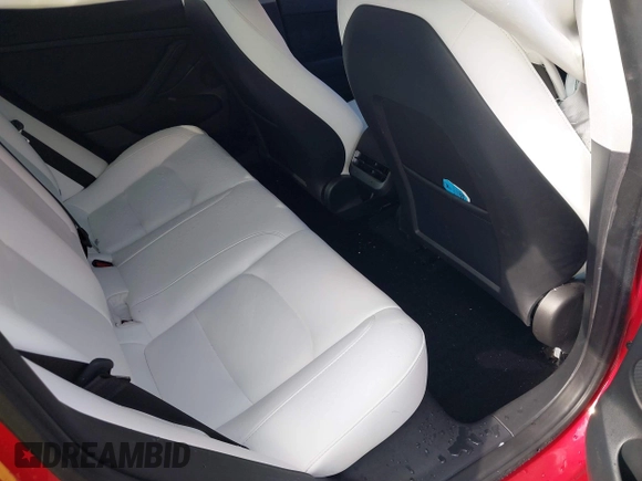 2023 Tesla Model 3 with VIN 5YJ3E1EA2PF588467, listed as a IAAI auction lot 42254921 with 11,217 mi miles and . Bid and sale history available at DreamBid. Image 8.