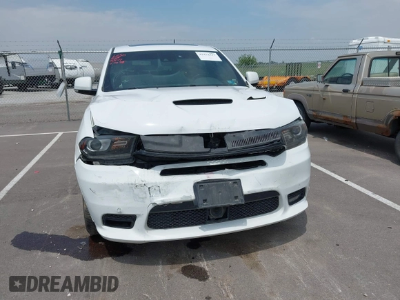 2018 Dodge Durango SRT with VIN 1C4SDJGJ2JC434843, listed as a IAAI auction lot 42434327 with 144,483 mi miles and . Bid and sale history available at DreamBid. Image 6.