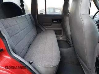 1996 Jeep Cherokee Sport with VIN 1J4FJ68S8TL285995, listed as a Copart auction lot 73333574 with 187,429 mi miles and Salvage Title. Bid and sale history available at carsss.com. Image 11.