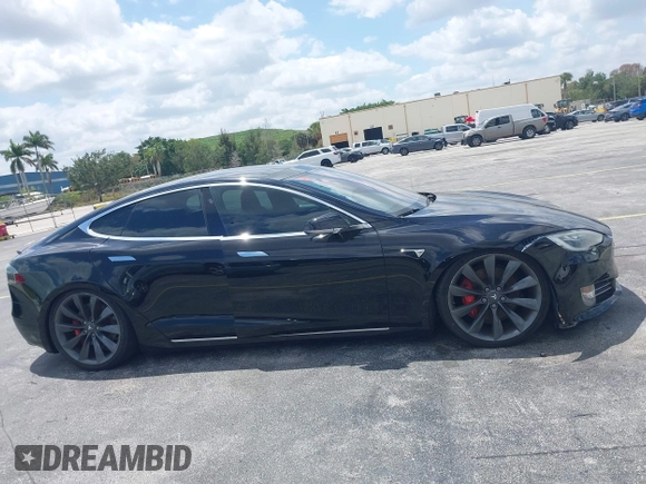 2017 Tesla Model S 100D with VIN 5YJSA1E47HF185734, listed as a IAAI auction lot 42076544 with 56,682 mi miles. Bid and sale history available at carsss.com. Image 12.