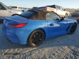 2022 BMW Z4 sDrive30i with VIN WBAHF3C02NWX38818, listed as a Copart auction lot 76604404 with 16,402 mi miles and Salvage Title. Bid and sale history available at carsss.com. Image 3.