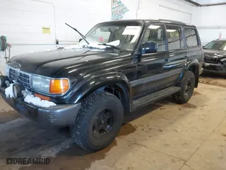 1997 Toyota Land Cruiser with VIN JT3HJ85J1V0184599, listed as a IAAI auction lot 41571386 with 305,201 mi miles. Bid and sale history available at carsss.com. Image 2.