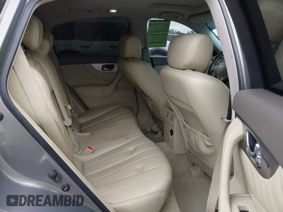 2014 Infiniti QX70 z VIN JN8CS1MU3EM451745, wystawiony jako IAAI lot #42203922 z przebiegiem 144 990 mil mil oraz . Historia ofert i sprzedaży dostępna na DreamBid. Obrazek 8.