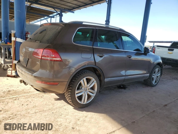 2012 Volkswagen Touareg Exec with VIN WVGEF9BP8CD008665, listed as a Copart auction lot 84611354 with 103,090 mi miles and Salvage Title. Bid and sale history available at DreamBid. Image 3.