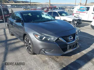 2018 Nissan Maxima Platinum z VIN 1N4AA6AP7JC392710, wystawiony jako IAAI lot #41866951 z przebiegiem 49 026 mil mil oraz . Historia ofert i sprzedaży dostępna na DreamBid. Obrazek 1.
