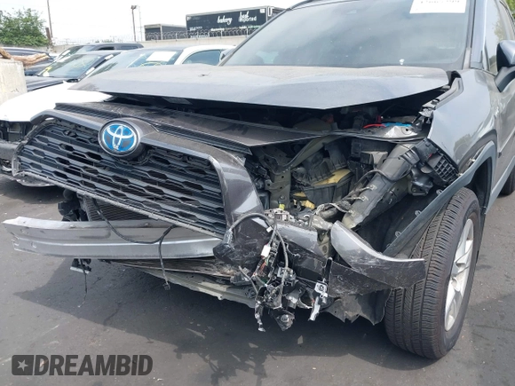 2020 Toyota RAV4 Hybrid XLE with VIN 2T3RWRFV5LW058103, listed as a IAAI auction lot 42665299 with 112,634 mi miles and . Bid and sale history available at DreamBid. Image 6.
