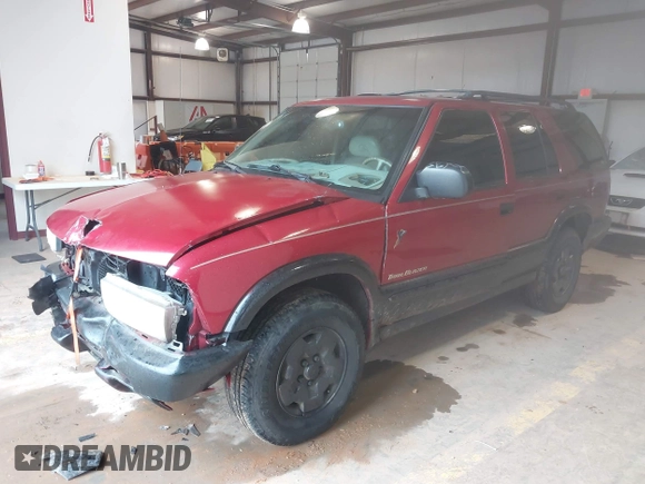 1999 Chevrolet Blazer Trailblazer z VIN 1GNDT13W4X2187490, wystawiony jako IAAI lot #41966073 z przebiegiem 187 604 mil mil oraz . Historia ofert i sprzedaży dostępna na DreamBid. Obrazek 18.