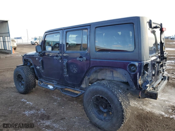 2013 Jeep Wrangler Unlimited Freedom Edition with VIN 1C4BJWDG4DL586397, listed as a Copart auction lot 45214165 with 103,524 mi miles and Salvage Title. Bid and sale history available at carsss.com. Image 2.