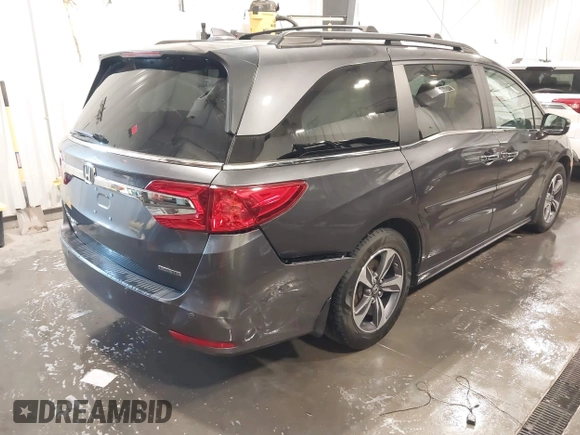 2018 Honda Odyssey Touring with VIN 5FNRL6H84JB041309, listed as a IAAI auction lot 42272247 with 90,371 mi miles and . Bid and sale history available at DreamBid. Image 6.