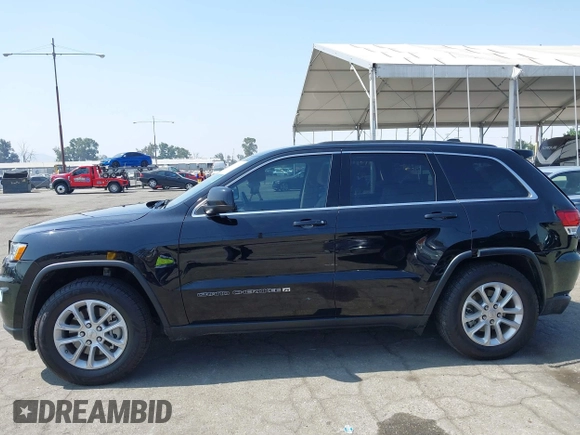 2022 Jeep Grand Cherokee Laredo X with VIN 1C4RJEAG7NC171377, listed as a IAAI auction lot 42592264 with 69,074 mi miles and . Bid and sale history available at DreamBid. Image 14.