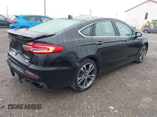 2019 Ford Fusion Titanium with VIN 3FA6P0D92KR125864, listed as a IAAI auction lot 42425422 with 109,340 mi miles and . Bid and sale history available at DreamBid. Image 4.