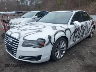 2012 Audi A8 с VIN WAUAVAFD9CN025571, выставлен на аукционе IAAI как лот 41919518 с пробегом 134 341 миль миль и . История ставок и продаж доступна на DreamBid. Изображение 2.