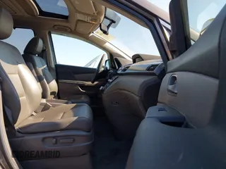 2012 Honda Odyssey Touring with VIN 5FNRL5H95CB057346, listed as a IAAI auction lot 42644094 with 114,712 mi miles and . Bid and sale history available at DreamBid. Image 5.
