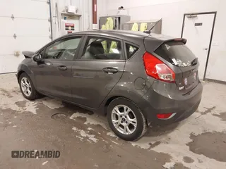 2015 Ford Fiesta SE z VIN 3FADP4EJ8FM138306, wystawiony jako IAAI lot #41227124 z przebiegiem 106 741 mil mil oraz . Historia ofert i sprzedaży dostępna na DreamBid. Obrazek 3.
