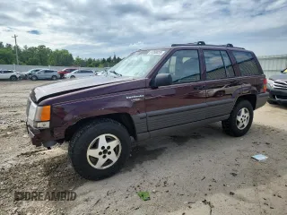 1994 Jeep Grand Cherokee Laredo z VIN 1J4GZ58S0RC221854, wystawiony jako Copart lot #61950825 z przebiegiem 69 465 mil mil oraz Czysty tytuł • Clean title. Historia ofert i sprzedaży dostępna na DreamBid. Obrazek 1.