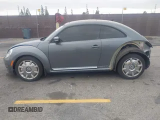 2013 Volkswagen Beetle 2.5L with VIN 3VWJP7AT6DM667477, listed as a IAAI auction lot 42215545 with 87,392 mi miles and . Bid and sale history available at DreamBid. Image 14.