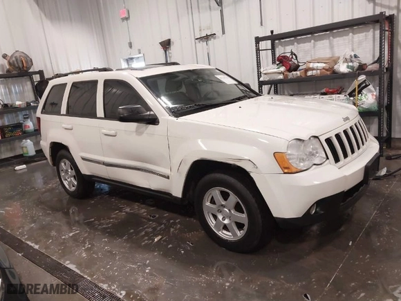 2010 Jeep Grand Cherokee Laredo with VIN 1J4PR4GK1AC143486, listed as a IAAI auction lot 41761763 with 159,139 mi miles. Bid and sale history available at carsss.com. Image 1.