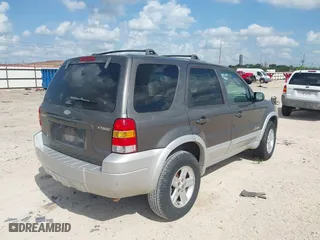 2005 Ford Escape Hybrid with VIN 1FMCU95H55KC07544, listed as a IAAI auction lot 42104756 with 250,109 mi miles. Bid and sale history available at carsss.com. Image 4.