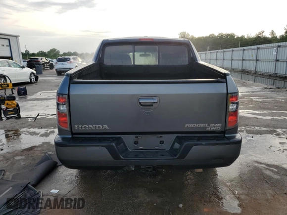 2012 Honda Ridgeline RTL с VIN 5FPYK1F56CB456555, выставлен на аукционе Copart как лот 54237205 с пробегом 191 967 миль миль и Списание • Salvage title. История ставок и продаж доступна на DreamBid. Изображение 6.