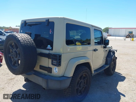 2011 Jeep Wrangler Sahara with VIN 1J4AA5D13BL562732, listed as a IAAI auction lot 41838520 with 148,359 mi miles and . Bid and sale history available at DreamBid. Image 4.