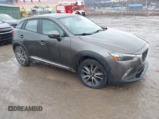 2016 Mazda CX-3 Grand Touring with VIN JM1DKBD77G0107328, listed as a IAAI auction lot 41682949 with 156,935 mi miles. Bid and sale history available at carsss.com. Image 1.