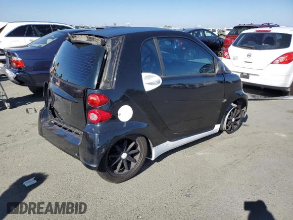 2009 Smart fortwo Pure z VIN WMEEJ31X49K253051, wystawiony jako Copart lot #70193934 z przebiegiem Nie podano mil oraz Szkody całkowita. Historia ofert i sprzedaży dostępna na DreamBid. Obrazek 3.